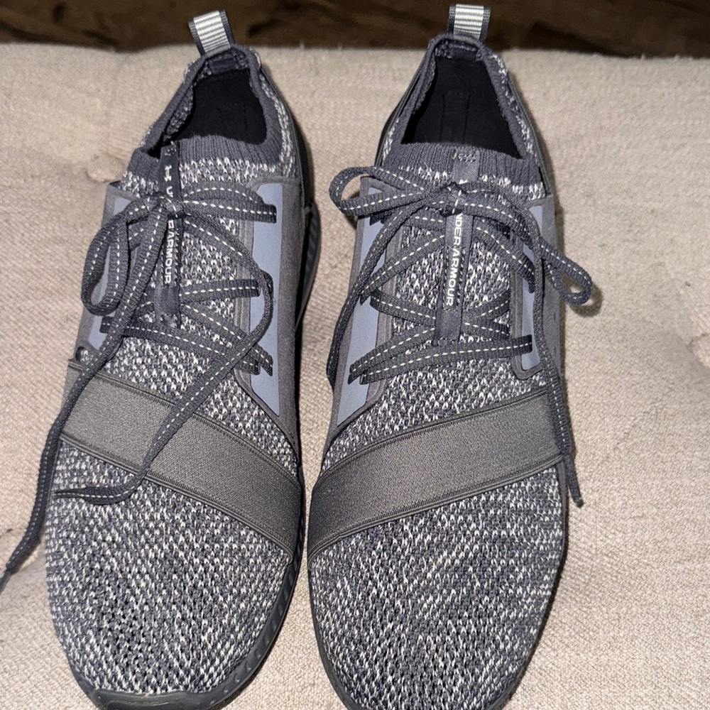 NWOT, Under Armour athletic shoes in a soft gray/ textured gray weave design.